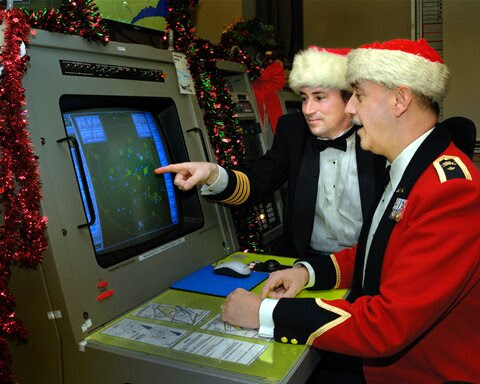 Col Pierre Ruel and BGen Christian
Barabé check the radar screen in preparation for tracking Santa Claus in December of 2007.