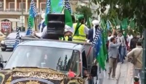 Greece: Muslim migrants march with flag of pro-Sharia Pakistani group