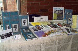 PHOTO CUTLINE: Copies of Tarnished Trophies (Black Moss Press) by Debbie Okun Hill were spotted at one of the Book Fair tables.