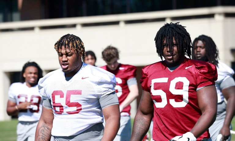 Alabama OL JC Latham (#65) on the field for 2022 Spring Football Practice