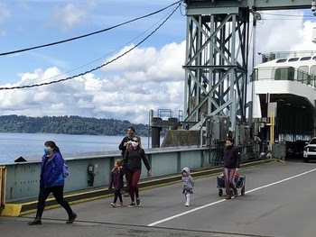 Photo of people walking off a ferry