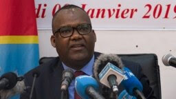 Le président de la Commission électorale nationale indépendante (CENI) de la RDC, Corneille Nangaa Yobeluo, annonce les résultats provisoires de l'élection présidentielle à Kinshasa du 10 janvier 2019.