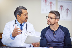 man discussing results with doctor