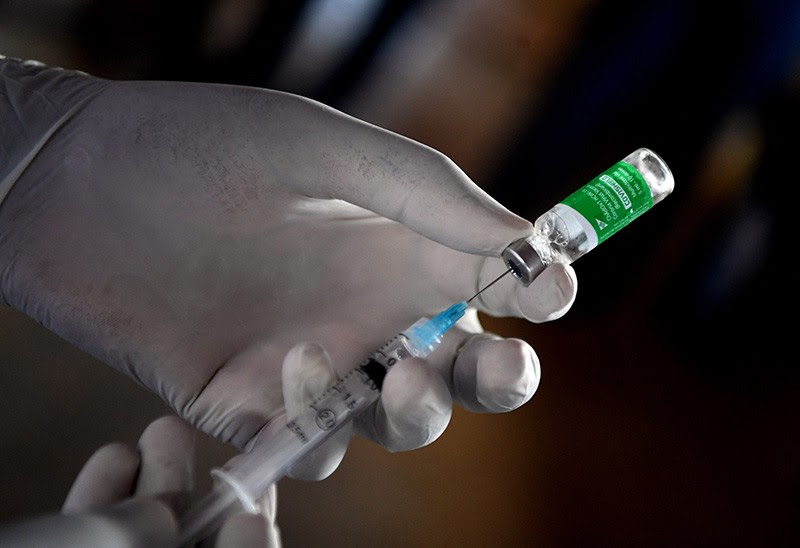 A health worker prepares a dose of the Oxford/AstraZeneca COVID-19 vaccine in Francistown, Botswana.