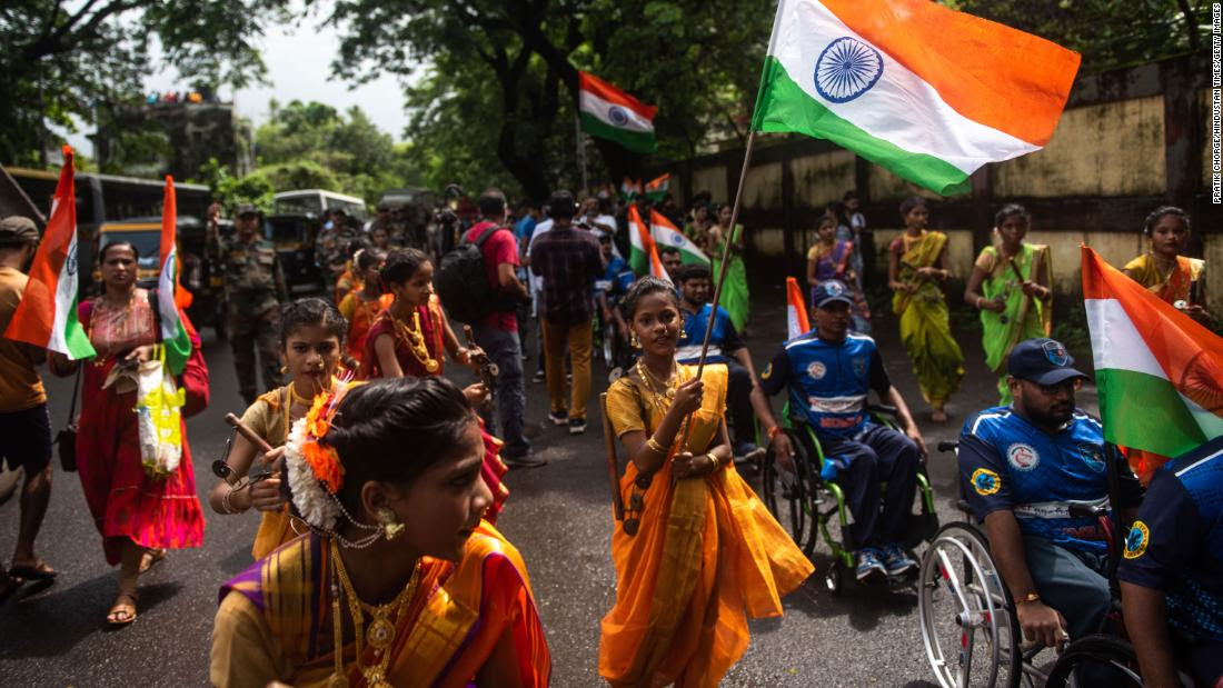 Women in traditional attire participate in a rally to mark the 75th anniversay of India&#39;s Independence Day in Mumbai, India, on August 14, 2022.