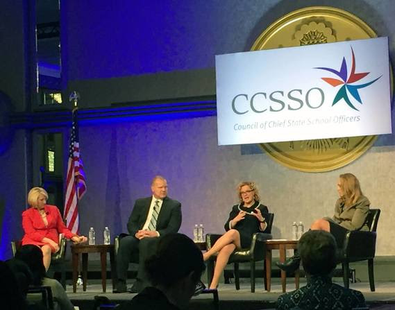 Superintendent Balow talks on a stage with the state chiefs from Florida and Illinois during a panel moderated by the Interim Director of CCSSO. A large sign hangs behind the stage that reads CCSSO Council of Chief State School Officers.