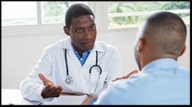 The figure shows an African American doctor explaining a diagnosis to a patient.