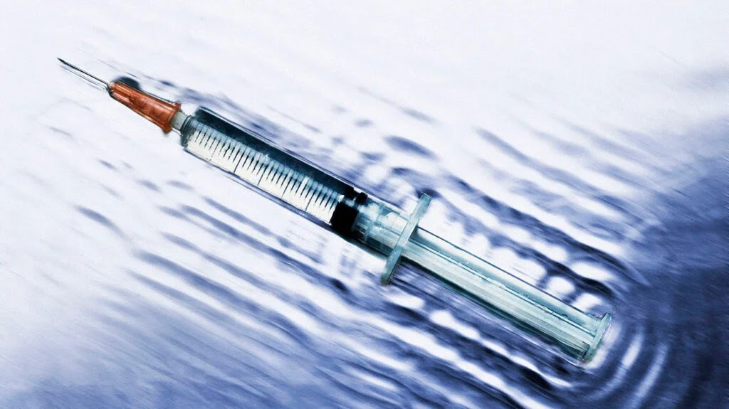 an injection syringe containing medication or vaccine