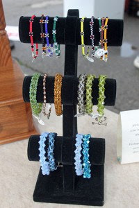 There are several jewelry vendors at the Saturday Farmers Market. 