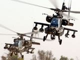 An air weapons team of two AH-64D Apaches from the 1st Battalion, 227th Aviation Regiment, 1st Air Cavalry Brigade, 1st Cavalry Division, come in for a landing at Camp Taji, Iraq, after completing a reconnaissance mission in the skies over Baghdad Nov. 6, 2007. (Image: U.S. Army) ** FILE **