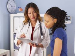 image of a doctor talking with a patient 