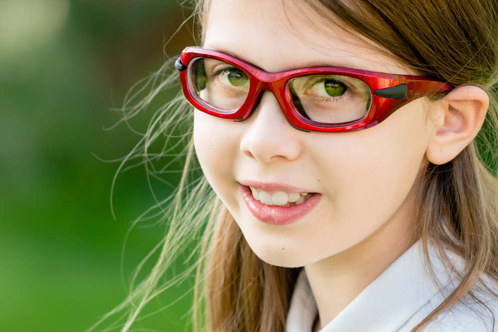 girl wearing sports goggles for eye protection