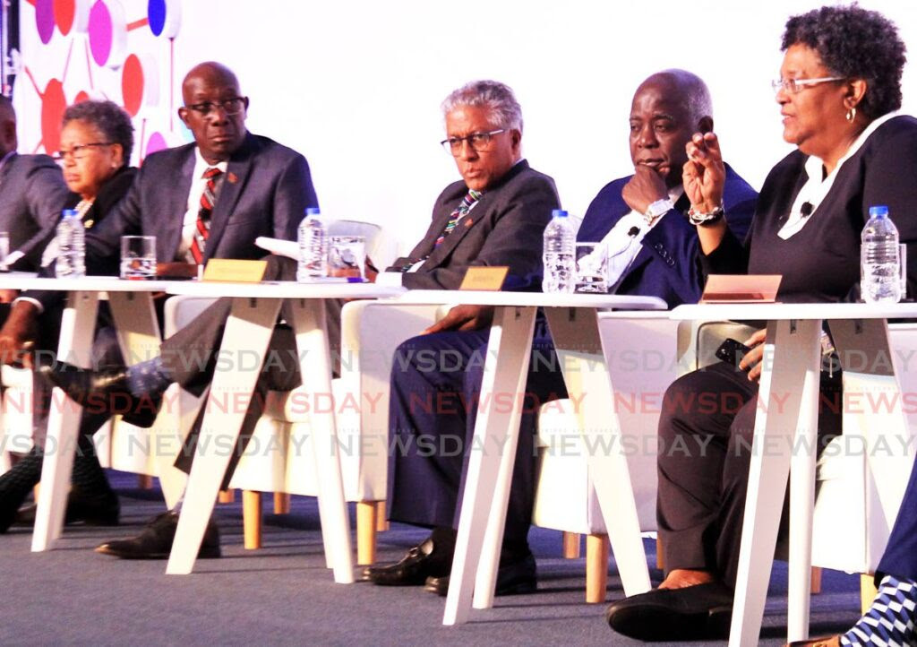 MIA SPEAKS: Barbados Prime Minister Mia Mottley, right, makes a point during a roundtable discussion at the Caricom crime symposium on Monday at the Hyatt Regency in Port of Spain. Second from left, TT PM Dr Keith Rowley listens attentively. Photo by Ayanna Kinsale