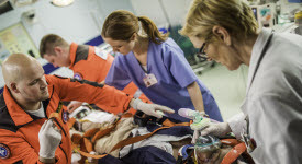 Image of emergency responders treating patient