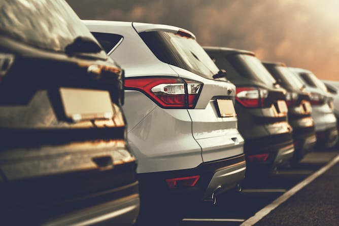 Electric SUVs parked in a row.