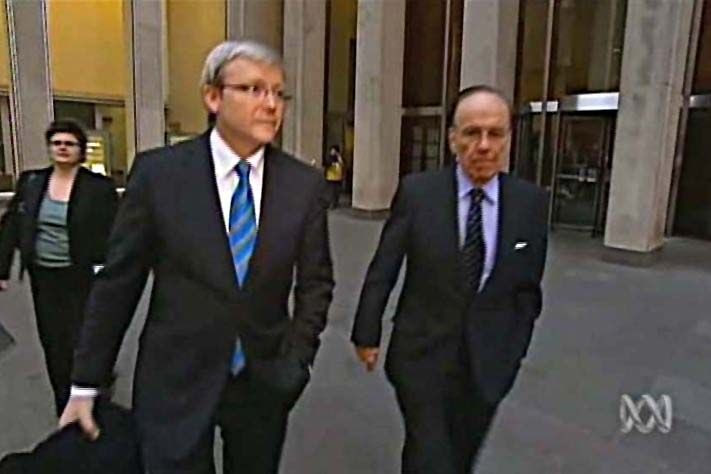 Media mogul Rupert Murdoch and Opposition Leader Kevin Rudd walk out of News Corp headquarters