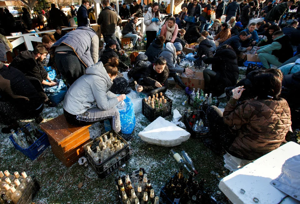 Residents prepare Molotov cocktails.