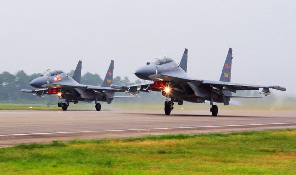 In this undated file photo released by China&#39;s Xinhua News Agency, two Chinese SU-30 fighter jets take off from an unspecified location to fly a patrol over the South China Sea. China flew more than 30 military planes, including SU-30 fighter jets, toward Taiwan on Saturday, Oct. 3, 2021, the second large display of force in as many days.(Jin Danhua/Xinhua via AP) **FILE**