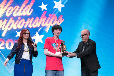 Nintendo of America Senior Vice President of Sales & Marketing Doug Bowser awards winner Thomas Gond ...