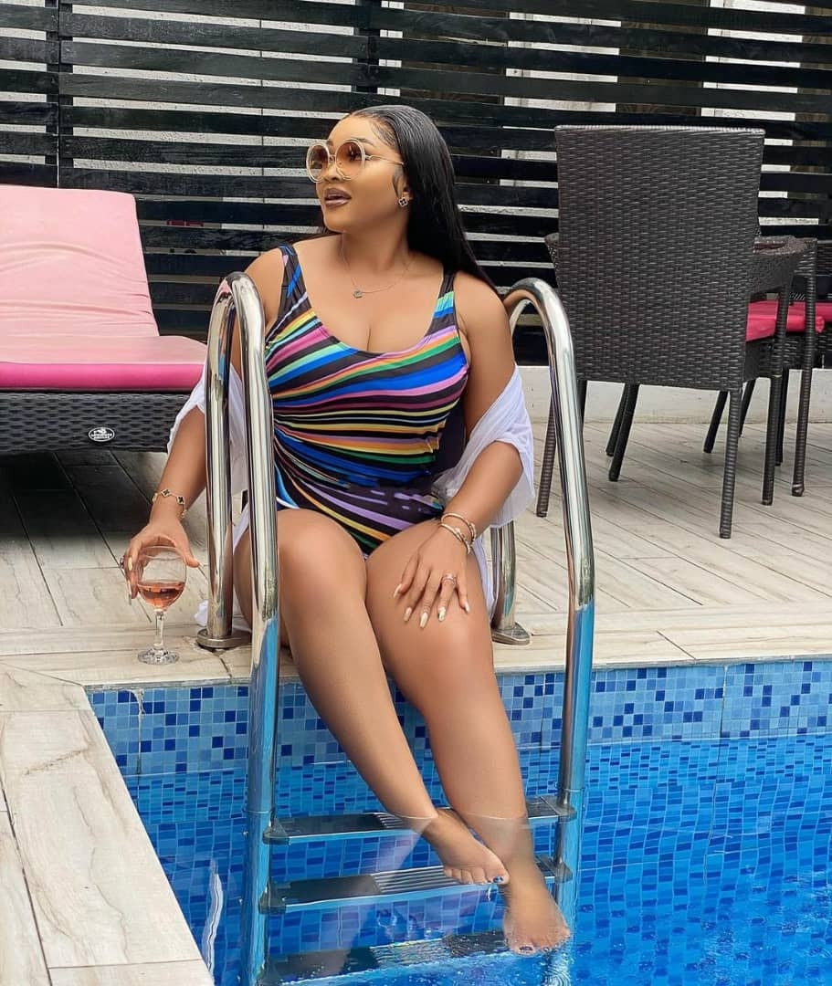 Mercy Aigbe flaunts her curves in multi-colored swimwear
