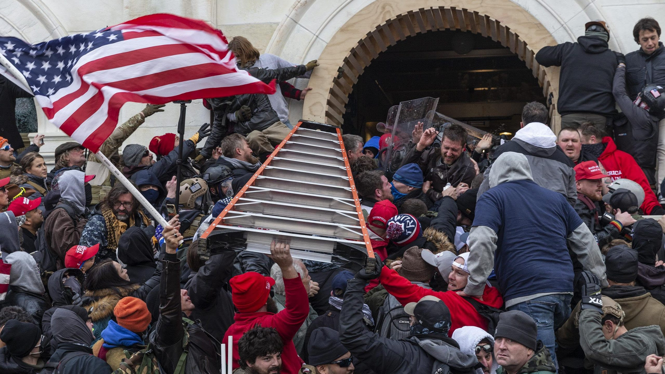 Jan 6th insurrection violence captured in protest photographs.