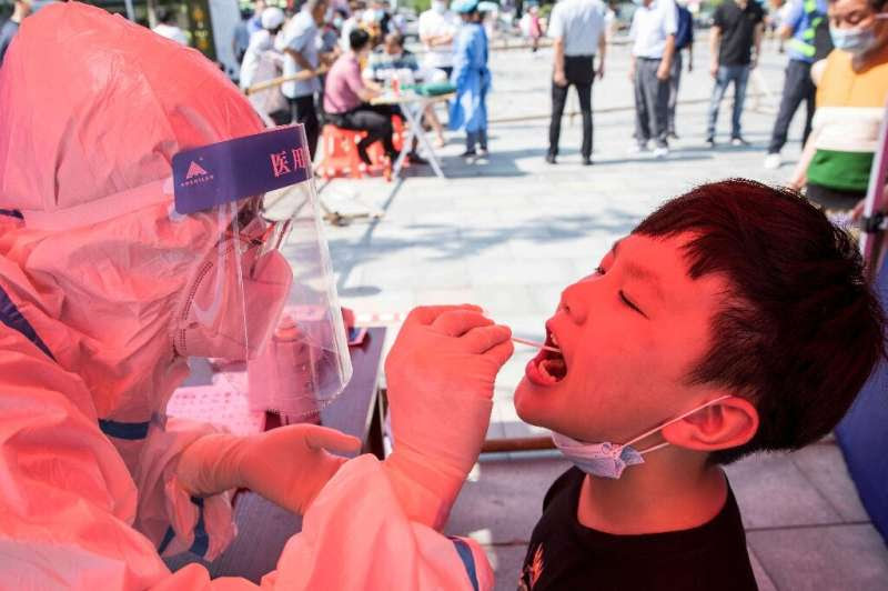 China's worst surge of coronavirus infections in months spread to two more areas