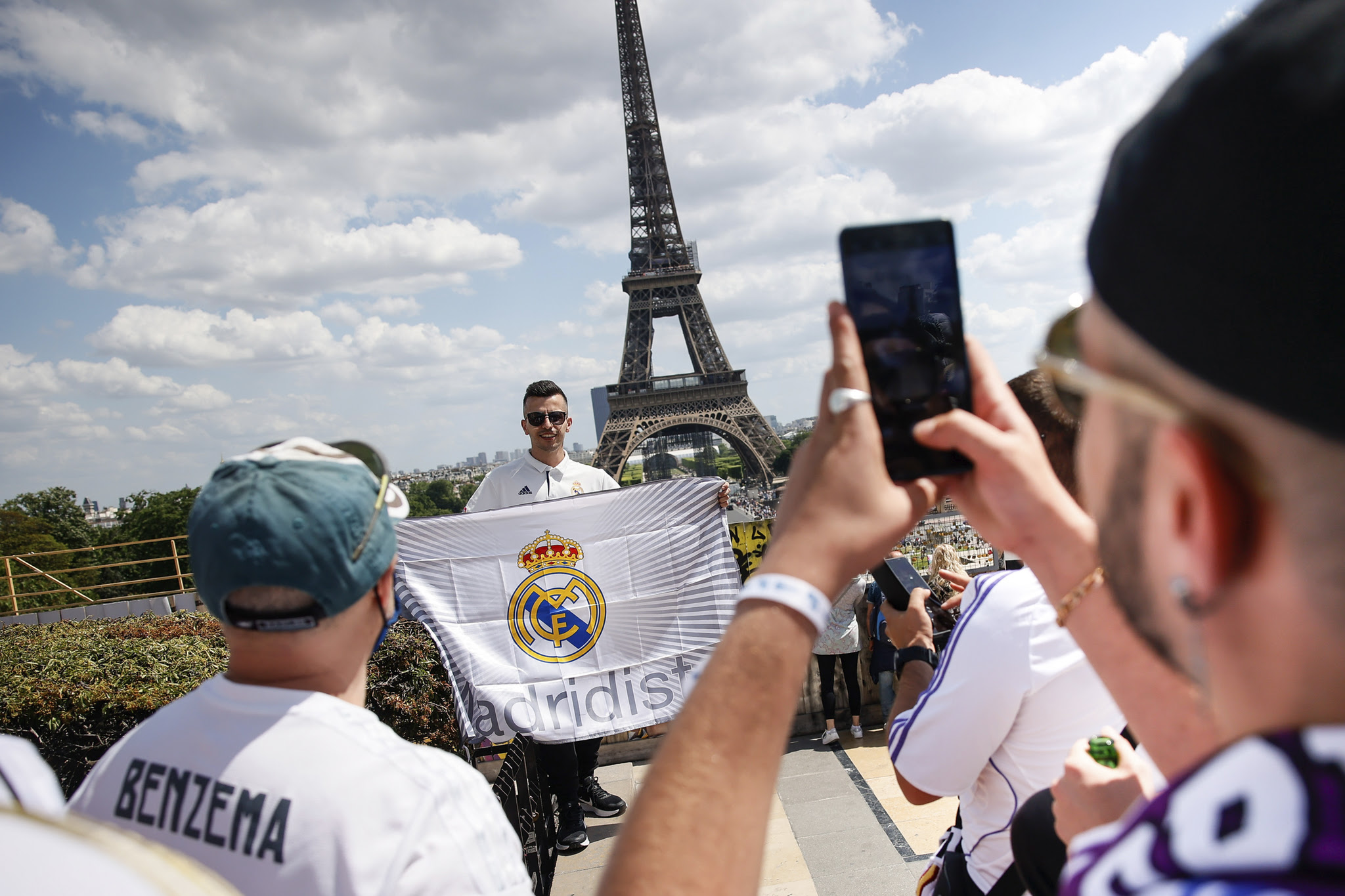 Real Madrid supporters pose for a photograph near the Eiffel Tower in Paris, Saturday, May 28, 2022 ahead of Saturday's lt;HIT gt;Champions lt;/HIT gt; lt;HIT gt;League lt;/HIT gt; final soccer match between Liverpool and Real Madrid at the Stade de France. (AP Photo/Thomas Padilla)
