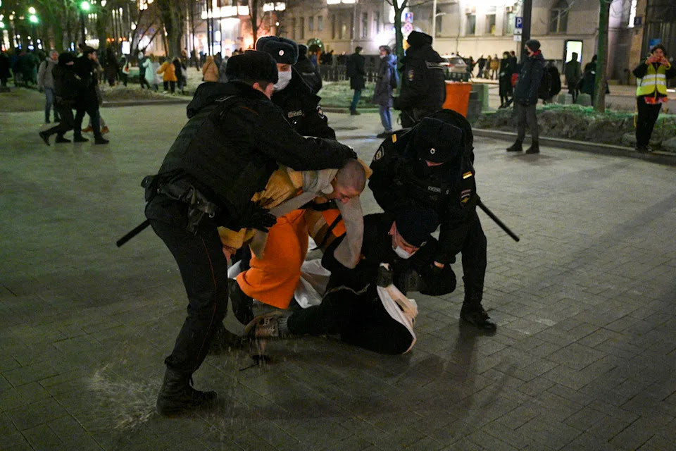 Police officers detain demonstrators in Moscow, Russia, Thursday, Feb. 24, 2022, after Russia's attack on Ukraine. Hundreds of people gathered in the center of Moscow on Thursday, protesting against Russia's attack on Ukraine. Many of the demonstrators were detained. Similar protests took place in other Russian cities, and activists were also arrested. (AP Photo/Dmitry Serebryakov)