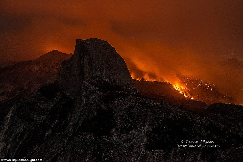 Raging inferno:  Bloody red skies and forbidding clouds of smoke blocking out the dusky evening sky 