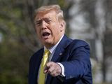 President Donald Trump gestures while walking on the South Lawn of the White House in Washington, Monday, March, 9, 2020, after stepping off Marine One. The president is returning from Florida. (AP Photo/Patrick Semansky)