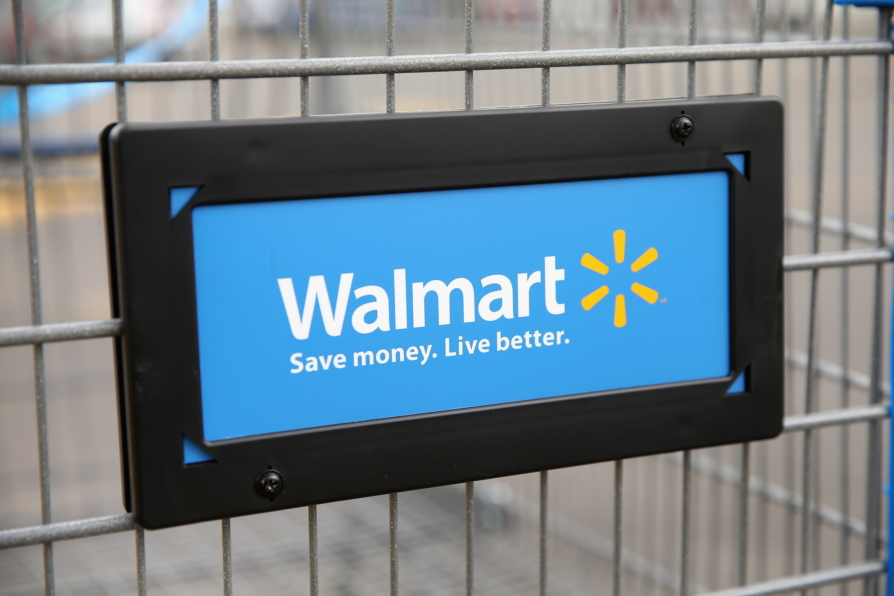 The Walmart logo is displayed on a shopping cart at a Walmart store on August 15, 2013 in Chicago, Illinois. (Photo by Scott Olson/Getty Images)