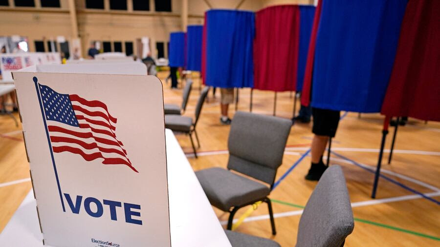 Voters cast their ballots at a polling station in Derry, N.H., on Tuesday, Sept. 13, 2022.