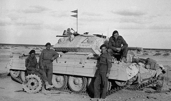 Black and white photograph of 3rd County of London Crusader tank and crew, Libya, 1941