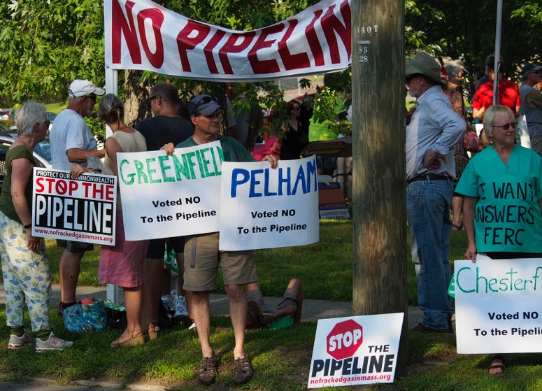 Protesters with Stop the Pipeline signs