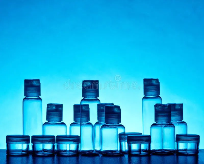 Empty blue glass bottles stock image. Image of standing 25515201