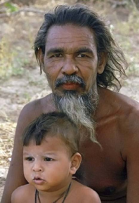 Modern Vedda man and his child. Photograph taken in Sri Lanka in 2002. (CeylonM/CC BY SA 4.0)
