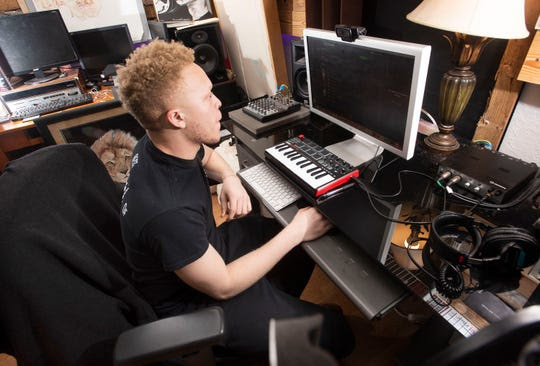 Aspiring musician Semme Jenkins lays down a new musical track inside his home recording studio on Thursday, Nov. 21, 2019.