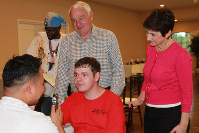 Tom Golisano, Paychex founder, philanthropist and father of a son with intellectual disability, gifts $30 million to Special Olympics to Expand Critical Health Services Globally for People with Intellectual Disabilities. Tom Golisano and Golisano Foundation Executive Director Ann Costello observe an eye screening at an event before the pandemic. Tom Golisano, Paychex founder, philanthropist and father of a son with intellectual disability, gifts $30 million to Special Olympics to Expand Critical Health Services Globally for People with Intellectual Disabilities. Tom Golisano and Golisano Foundation Executive Director Ann Costello observe an eye screening at an event before the pandemic.