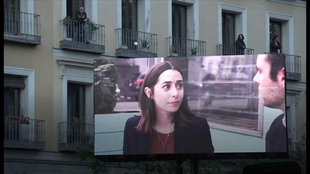 Coronavirus: Madrid's balcony cinema screens films for people in lockdown