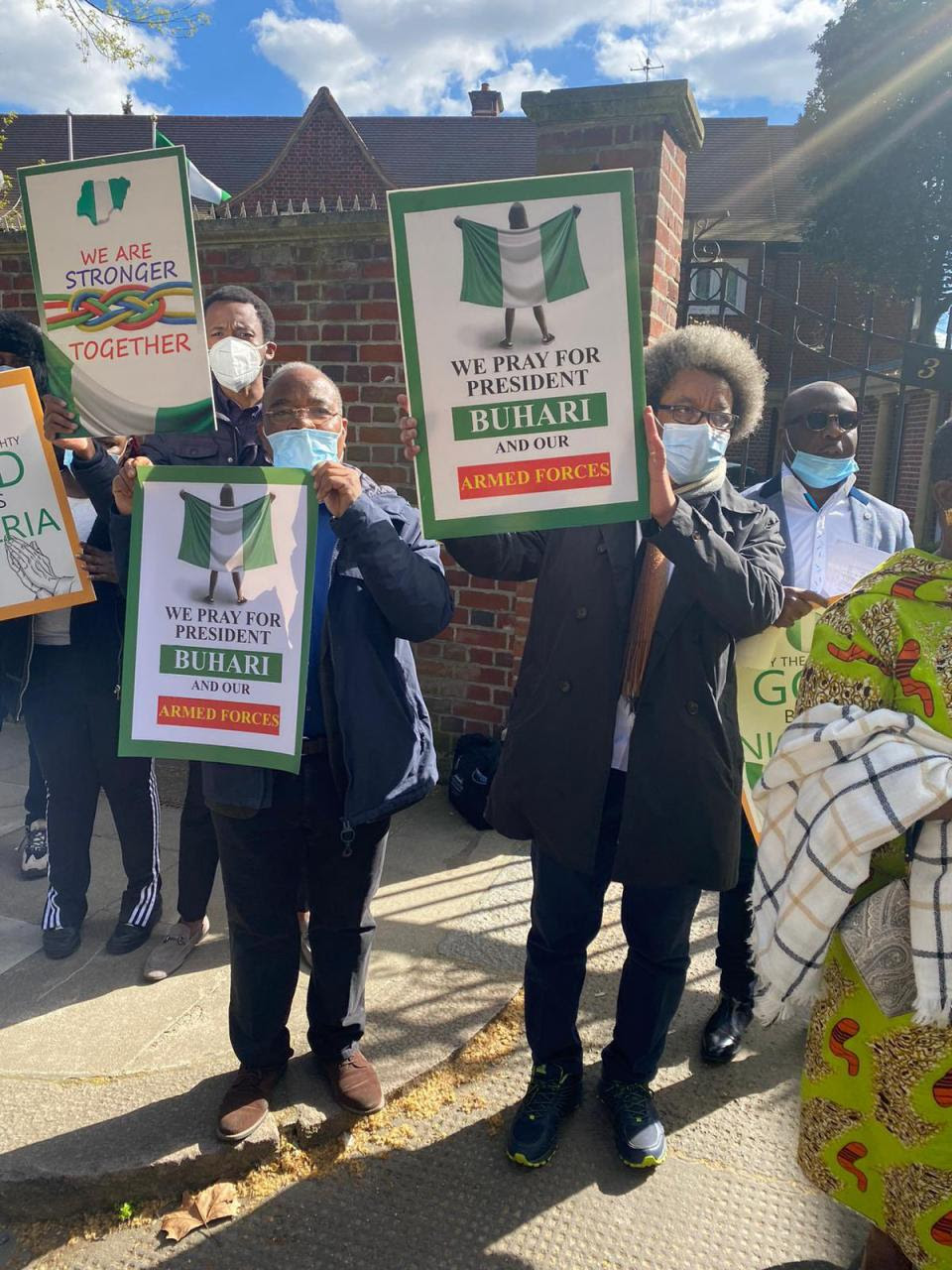 Presidential aide, Garba Shehu, shares photos and videos of Nigerians staging pro-Buhari protest at the Abuja house in the UK