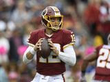 Washington Redskins quarterback Colt McCoy (12) looks to pass during the first half of an NFL football game against the New England Patriots, Sunday, Oct. 6, 2019, in Washington. (AP Photo/Nick Wass)
