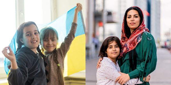 Children holding the Ukrainian flag and a hijabi woman hugging a child.