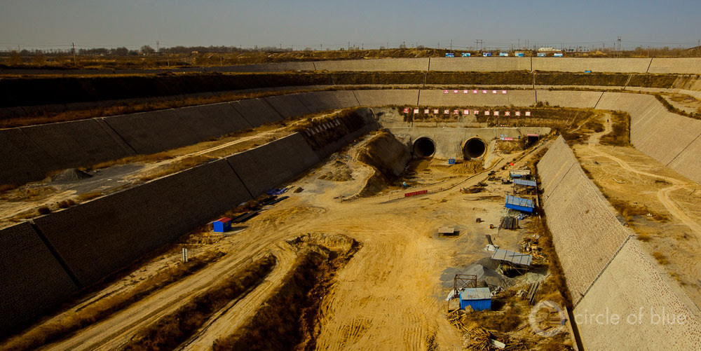 The $US 81 billion South-North Water Transfer Project is now in operation. The middle canal, under construction in this 2010 photo, opened late in 2014. China South-North Water Transfer World Economic Forum global risks report Aaron Jaffe Circle of Blue
