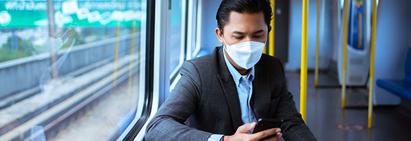 Vaccinated man showing digital vaccine certificate on mobile 
