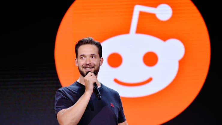 The co-founder of Reddit speaks into a microphone