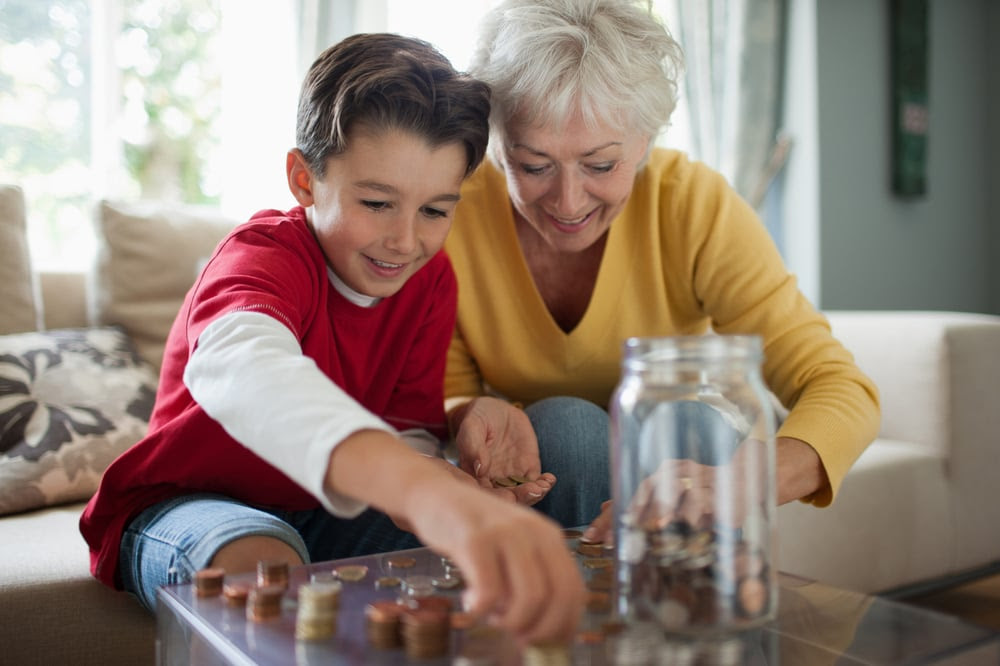 Older woman and child counting change Older woman and child counting change