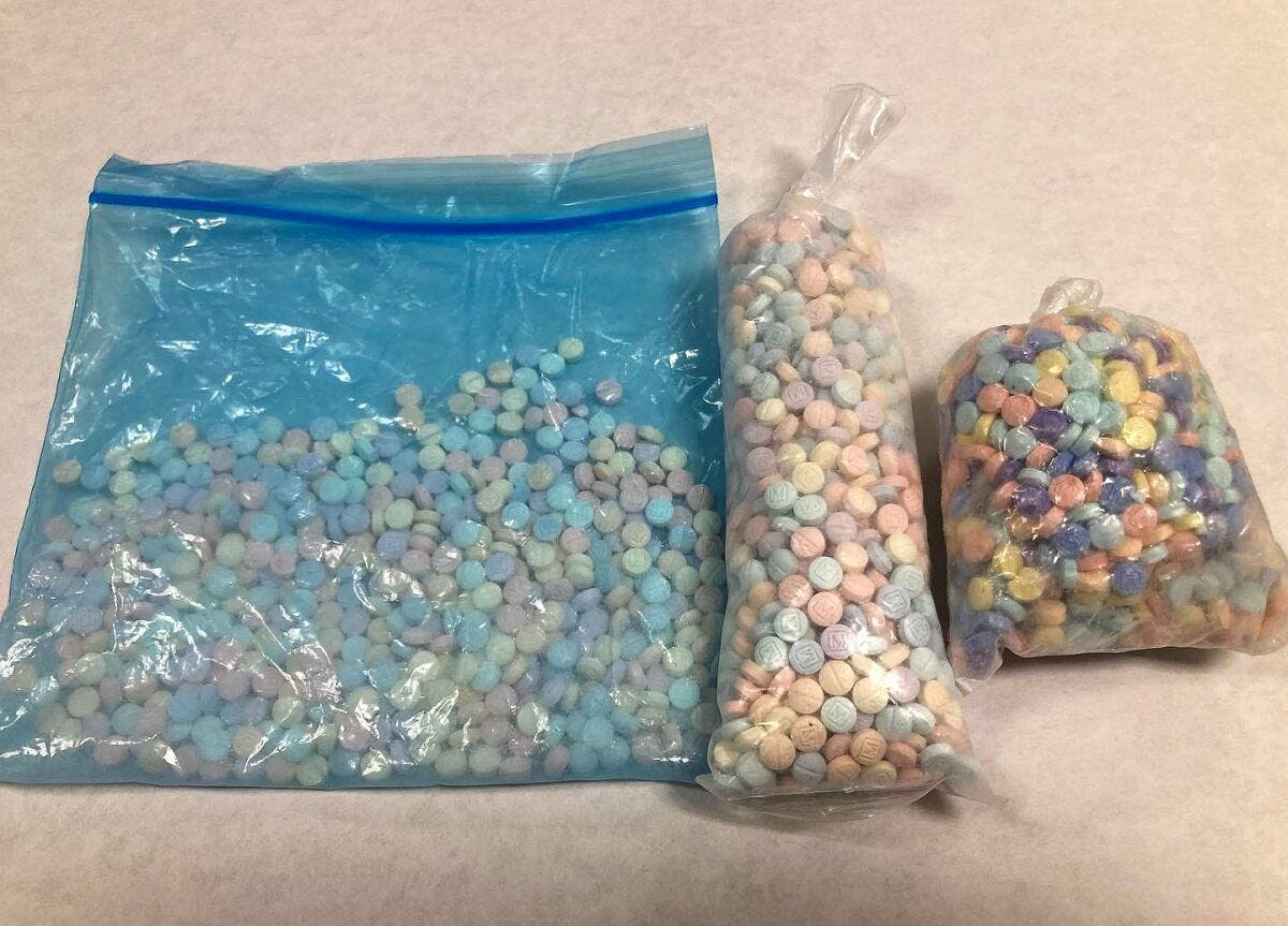 Candy-colored fentanyl pills inside three plastic bags
