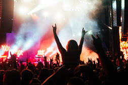 A crowd of people at a concertDescription automatically generated