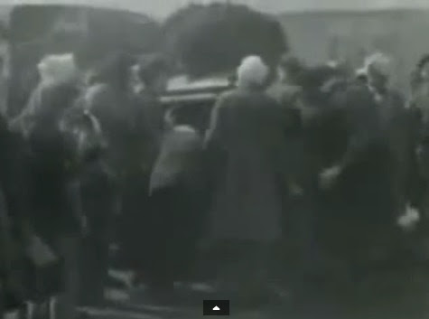 Such                             people are NOT Jewish detainees but GERMAN                             soldiers in gray coats and with head                             injuries with white head bandages. Here they                             are standing allegedly around a &quot;water                             lorry&quot;. (2min. 9sec.)
