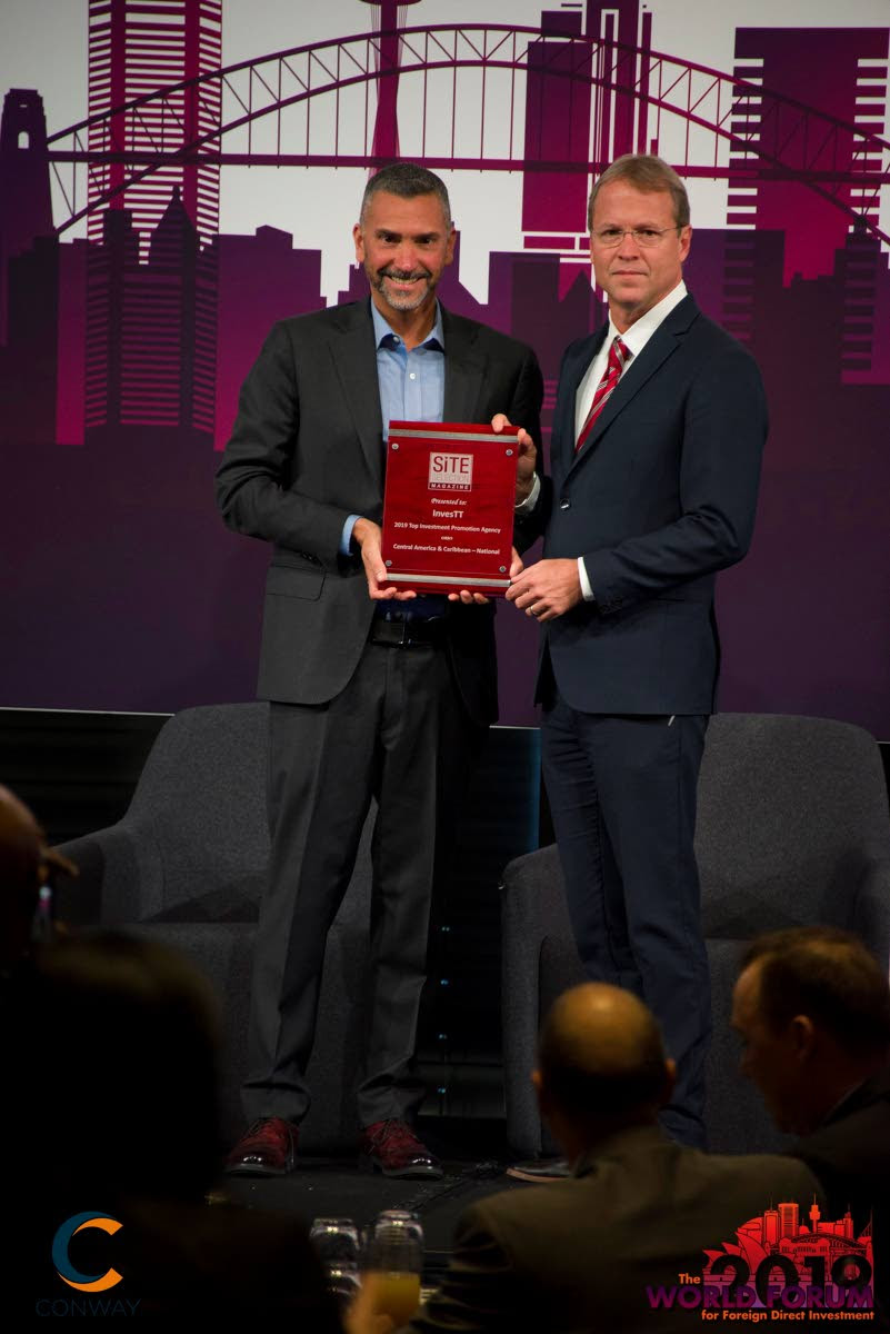 BIG WIN: President Conway Inc Adam Jones-Kelley (left) with InvesTT chairman Philip Knaggs at The World Forum for Foreign Direct Investment in Sydney, Australia in June.